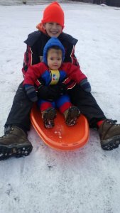 Jonathan Chloe sledding